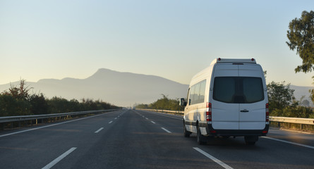 Fototapeta na wymiar sightseeing minibus performing transfer tourists to natural parkland