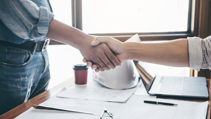 Meeting and greeting, Two engineer or architect meeting for project, handshake after consultation and conference new project plan, contract for both companies, success, partnership