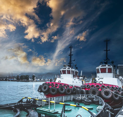 Two tugboats in the port Batumi at sunset, Georgia