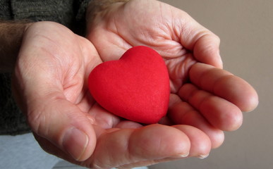 Man's hands giving heart. Saint Valentine's Day concept.
