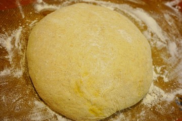 Making a ball with proofed yeast dough for miracle overnight no knead bread