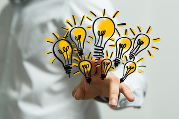 idea lamp concept in hand.