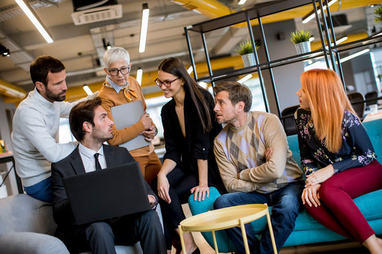 Group of young business people are working together with laptop