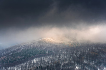 Dramatic and Moody Image of Weather in Mountains at Winter Time