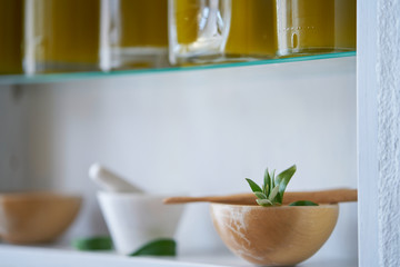 beautiful and nice closeup of a bowl detail blurred in kitchen shelf house bottles oil living home ,medicine alchemist pharmacy health