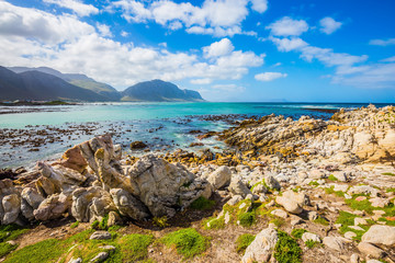  The azure water, boulders and algae