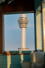 The observation tower on Samut Prakan coast, the look through window of ferry sailing on Chao Phraya river, Thailand. © milkovasa