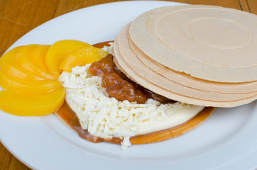 Wafer, traditional Colombian dessert, chopped fruit cookie and sauces