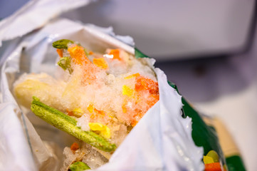 Freezer burned vegetables in plastic wrapping 