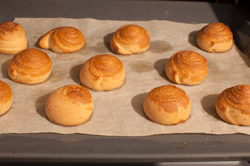 Homemade buns from the oven on a baking sheet