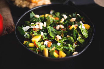 Mediterranean Spinach Salad with mango, peanuts, and red peppers