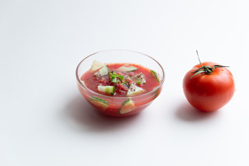 tomato and gazpacho soup bowl on white background