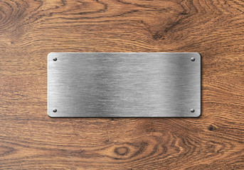 Blank polished silver plate on wooden background to ad text, names or logos