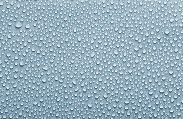 Rain drops background, blue colored water drops texture