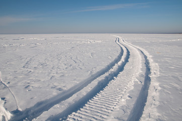 Footprints in the snow, frost, sunny weather.