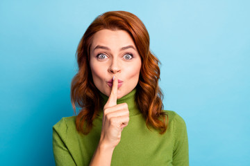 Naklejka premium Close-up portrait of her she nice attractive lovely cheerful cheery funny funky wavy-haired girl showing shh sign isolated over bright vivid shine vibrant green blue turquoise teal color background