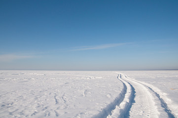 Footprints in the snow, frost, sunny weather.