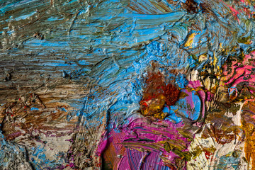 Background image of bright oil-paint palette closeup.