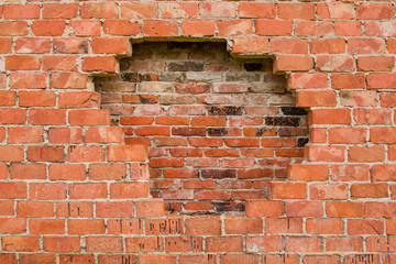 Hole in the brick wall, texture background.