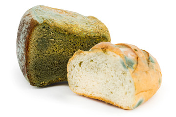 Mouldy bread on a white background. Expired pastries
