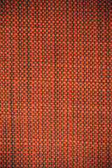 Macro view of orange fabric as texture and background for design. 