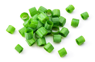 Green onion isolated. Heap of cut chives. Top view. - obrazy, fototapety, plakaty