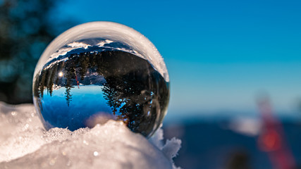 Crystal ball alpine winter wonderland shot at the famous Predigtstuhl, Bad Reichenhall, Bavaria, Germany