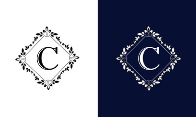 Classic floral monogram on black and white background with letter C. Design for wedding invitations, business sign.