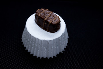 Various of sweet confectionery with chocolate candies and pralines. Handmade chocolates. Realistic chocolate set, delicious dessert pattern.