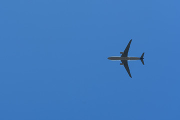 Bottom View of the Airplane in the sky with blank copy space for travel comcept