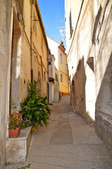 Obraz na płótnie Canvas Castelcivita, Italy. A narrow street between the old houses of a medieval village
