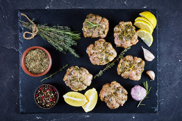raw rabbit ballotine on a slate tray