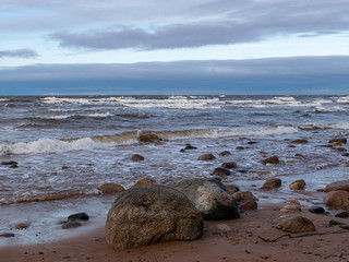 beautiful seascape, dark clouds and white waves