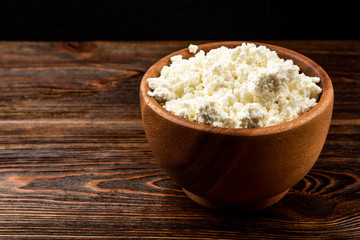 Cottage cheese on black background.