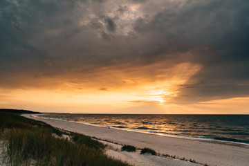 Late summer sunset on the Baltic sea coastline. Landscape of a beach near Ustka, Poland.
