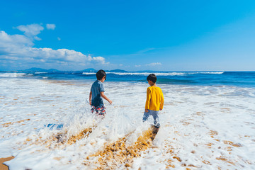 kids playing on the beach