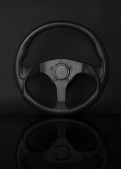 Steering wheel isolated on black