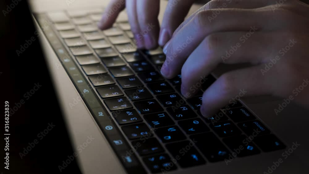 Poster close-up of man's hands typing on the keyboard. concept. men's hands type text on the keyboard at ni