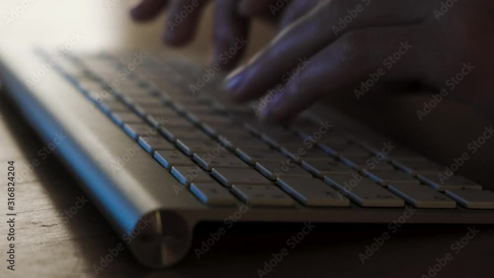 Poster close-up of man's hands typing on the keyboard. concept. men's hands type text on the keyboard at ni