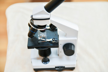 Microscope close-up. shot of microscope with metal lens with abstract with points, lines, and shapes