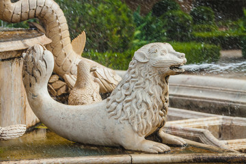 a mythological animal on the fountain in the park in Lisbon