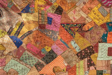 Colorful patchwork Hindu saris. Blanket made of many Hindu dress remains