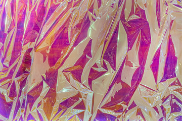 Modern conceptual crumpled cellophane film background. Strong wrinkled colorful texture
