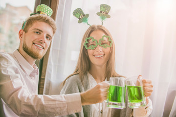 Group of friends celebrating St. Patrick's Day at a pub