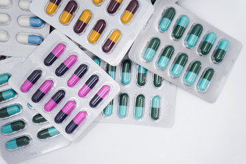 Colorful of tablets and capsules pill in blister packaging. Pharmaceutical industry concept. 