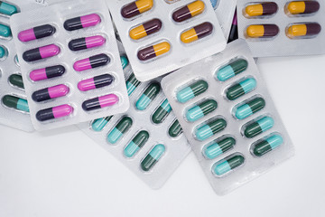 Colorful of tablets and capsules pill in blister packaging. Pharmaceutical industry concept. 