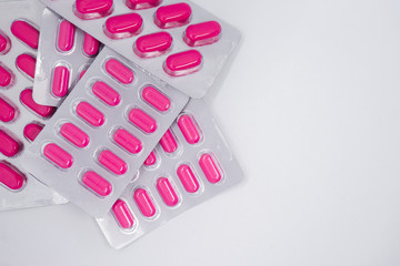 pink pills in blister pack, medications drugs. Pharmaceutical industry concept. 