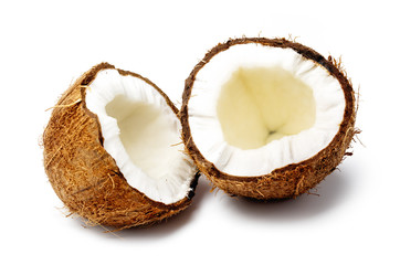 Fresh Raw Coconut broken in half isolated on white background