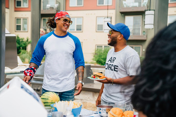 Air Force Veteran and friends having a 4th of July BBQ party at apartment complex. 