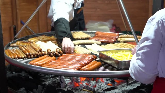 Street food background. Preparing grilled sausages. 